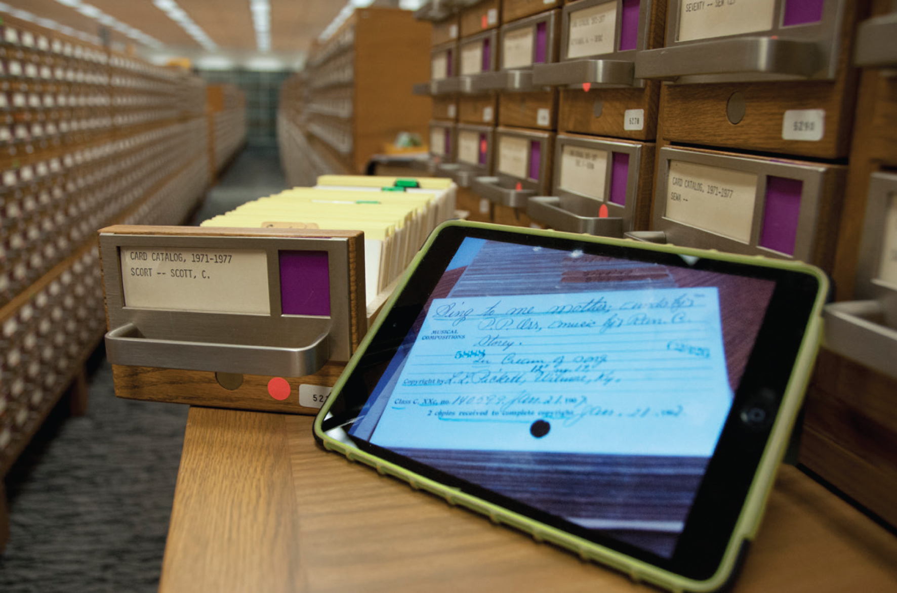 Tablet with scanned card; card catalog room and drawers